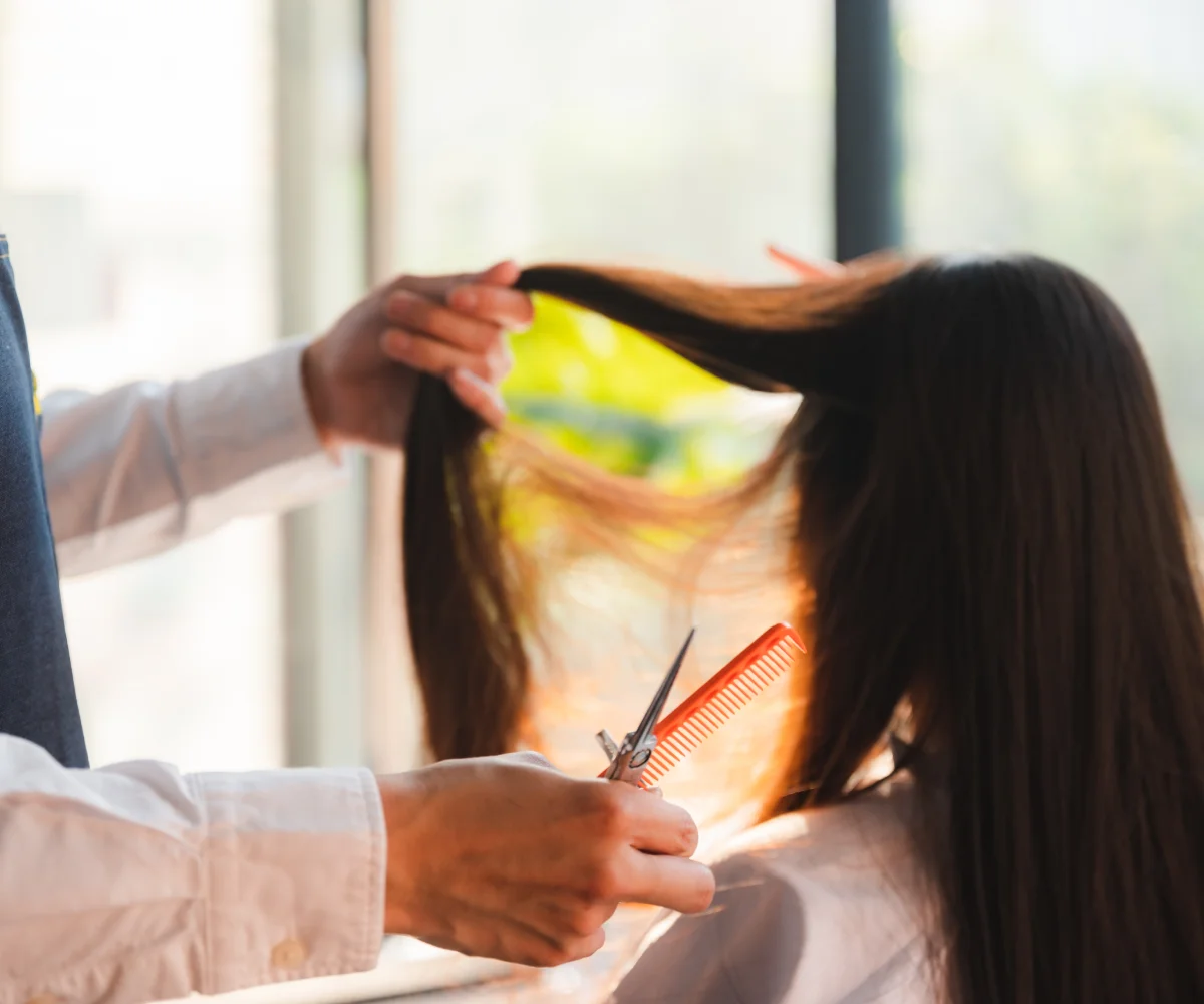 Hair specialist working on smooth, straightened hair